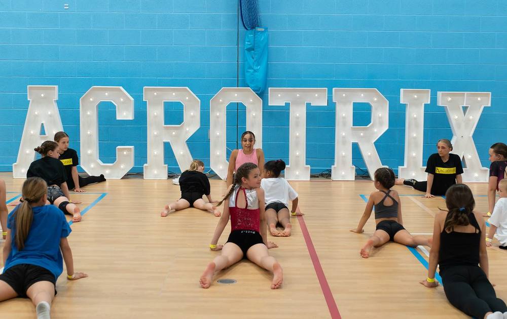 Acrotrix students training in a school sports hall