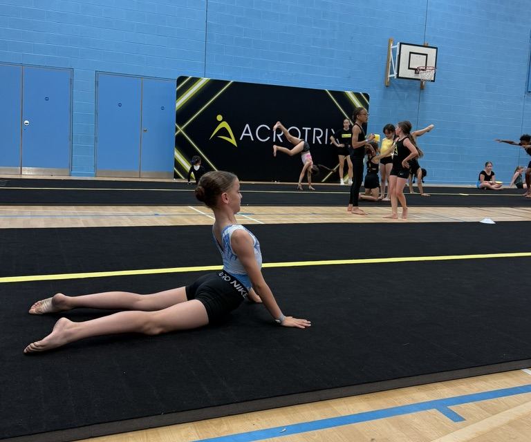 A student working through conditioning on the tumbling track